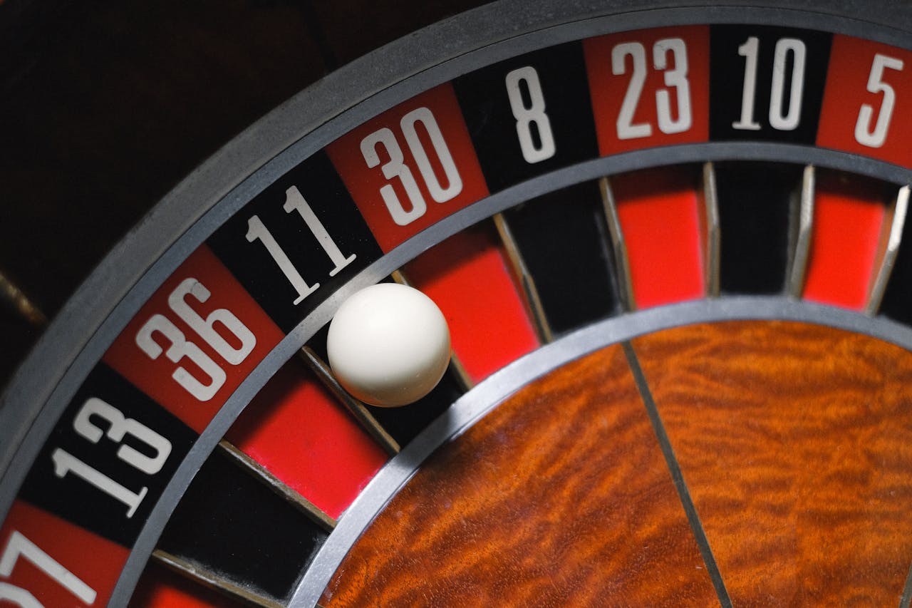 services-03 Detailed view of a roulette wheel with a ball, emphasizing the excitement of gambling.